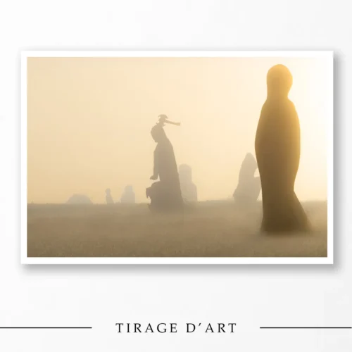 Granite statues of the Valley of the Saints in the mist at sunrise in Brittany